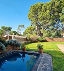 a swimming pool in the yard of a house at Serene Haven Guest House in Victoria West