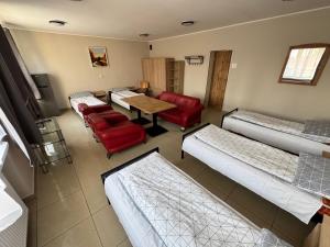 Ένα ή περισσότερα κρεβάτια σε δωμάτιο στο Relaks Noclegi