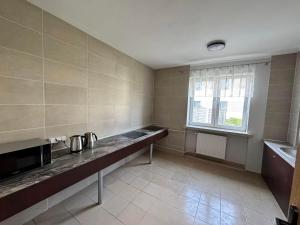 Η κουζίνα ή μικρή κουζίνα στο Relaks Noclegi +4 φωτογραφίες