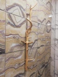 a cross on the side of a wall at Kalliomaja Villa Lummelahti in Savitaipale