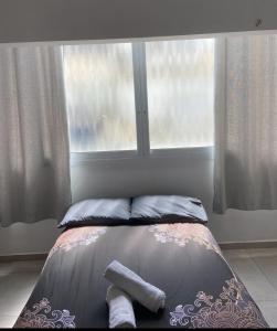 Ένα ή περισσότερα κρεβάτια σε δωμάτιο στο R suite