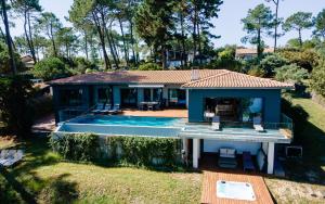 an aerial view of a house with a swimming pool at Villa-SONNIER-Biscarrosse in Biscarrosse