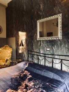 a bedroom with a bed and a mirror on the wall at Hotel Continental Cassino in Cassino