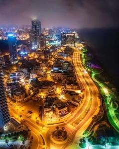 an overhead view of a city at night at R suite delux in Netanya