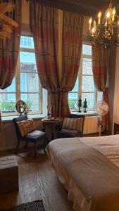 Ένα ή περισσότερα κρεβάτια σε δωμάτιο στο B&B Con Ampère