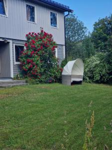 a tent in a yard next to a house at Sentralt leilighet i Harstad in Harstad +3 photos