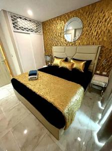 a bedroom with a large bed and a mirror at Large Sea View Room Quiet Side Copacabana in Ban Nong Pru