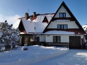 Το Apartamenty-Wynajem pokoi Zbigniew Tylka τον χειμώνα