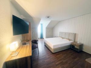 TV a/nebo společenská místnost v ubytování Zunfthaus zu Wirthen