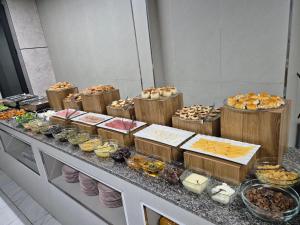 a buffet line with different types of food on it at Air Hotel in Tashkent