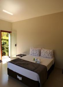 Postel nebo postele na pokoji v ubytování Pousada Dona Tereza