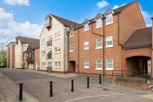 an empty street in front of a brick building at The Contractor Condo - Underground Parking in Aylesbury