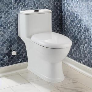 a white toilet in a bathroom with blue tiles at kolkumalai tent stay in Suryanelli