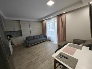 a living room with a couch and a table at Kavoliuko 14 in Vilnius