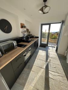 Køkken eller tekøkken på Studio dans maison typique du cap Corse