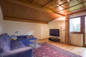 Телевизор и/или развлекательный центр в Haus Kaiserblick