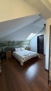 a bedroom with a large bed in a room at Pointview House Gesha in Dryanovo +50 photos