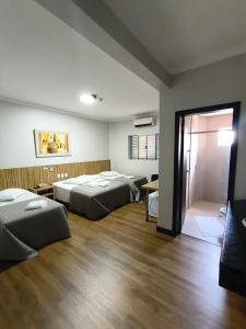 Postel nebo postele na pokoji v ubytování Hotel Talismã