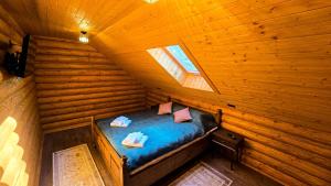 Postel nebo postele na pokoji v ubytování Cabana Valea Bistrei