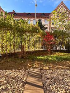 a wooden walkway in front of a building at Sunshine Luxury Apartment Private Parking in Cluj-Napoca