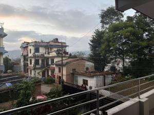 a view of a house from a balcony at The Kapil Homestay in Manamaiju