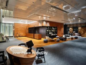 a lobby with a center piece in the city at Mitsui Garden Hotel Jingugaien Tokyo Premier in Tokyo