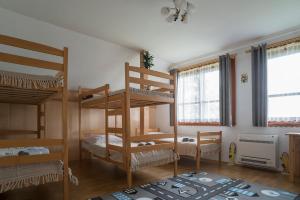 a room with three bunk beds in a room at Jaworówka na Polnej in Nowy Targ
