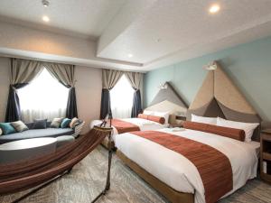 Ένα ή περισσότερα κρεβάτια σε δωμάτιο στο Rembrandt Style Sapporo