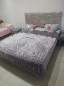 Postel nebo postele na pokoji v ubytování Rez-de-chaussée garage wifi 5Ggratuit gaz de ville + 2 fotografie