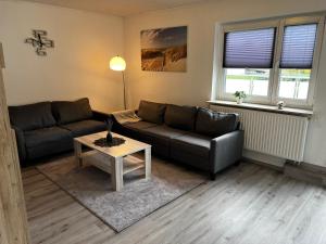 Posezení v ubytování FeWo Seenland + 22 fotografií