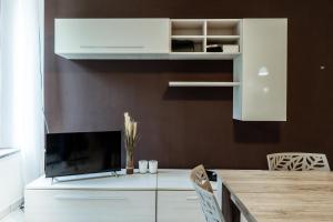 TV a/nebo společenská místnost v ubytování Appartamento Alice a Malpensa Aeroporto + 21 fotografií