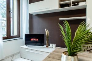 TV a/nebo společenská místnost v ubytování Appartamento Alice a Malpensa Aeroporto