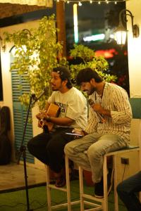 a group of three men sitting on chairs with a microphone at J Startup House - Coliving & Coworking, Jaipur - C Scheme in Jaipur