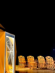 a group of chairs sitting next to a tent at Desert Front camp in Aqaba
