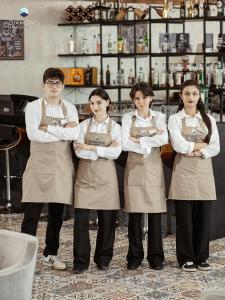 a group of four women standing in front of a counter at Hotel Diamond in Baku