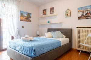 Postel nebo postele na pokoji v ubytování SWEETHOME ARENA VIEW - con parcheggio