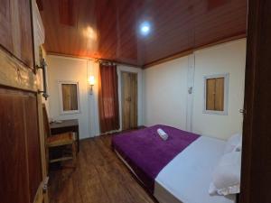 Postel nebo postele na pokoji v ubytování Lumera House