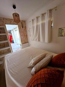 a bedroom with a bed with a shark pillow on it at Studio Conteneur in Cruscades