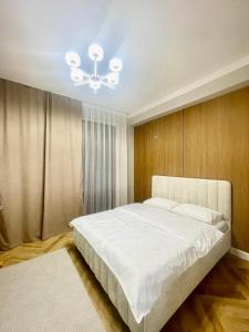 Ένα ή περισσότερα κρεβάτια σε δωμάτιο στο ЖК Керуен Сарай