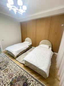 Ένα ή περισσότερα κρεβάτια σε δωμάτιο στο ЖК Керуен Сарай +3 φωτογραφίες