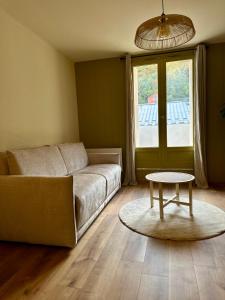 Posezení v ubytování Appartement avec terrasse, vue panoramique