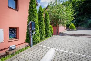 a parking meter on the side of a building at Hotel STARÝ PIVOVAR in Prague +44 photos