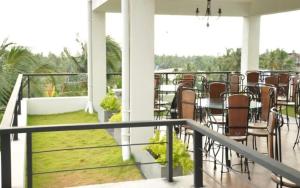 a balcony with chairs and a table on a patio at cockpit tower at colombo airport in Katunayake