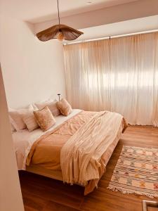 En eller flere senge i et værelse på Pirca NQN