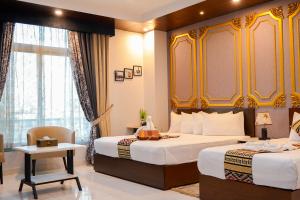 Ένα ή περισσότερα κρεβάτια σε δωμάτιο στο Ambrina Hotel