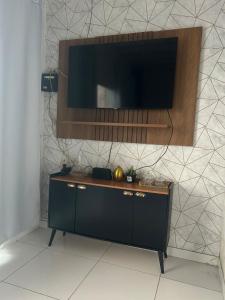 Et tv og/eller underholdning på Casa para 4 pessoas próximo ao Hangar