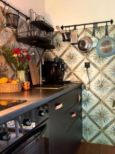 a kitchen with a sink and a counter top at Rogaty Domek przy Bobrowisku in Kornatka +17 photos