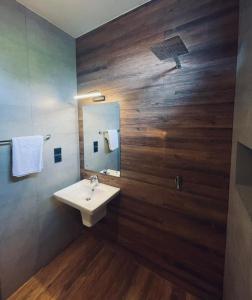 a bathroom with a sink and a mirror at Hidden Negombo By Sana's in Negombo