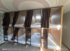 Ένα ή περισσότερα κρεβάτια σε δωμάτιο στο Екохостел