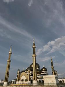 a mosque with domes and minarets in front of it at Z Homestay in Kuala Terengganu +4 photos